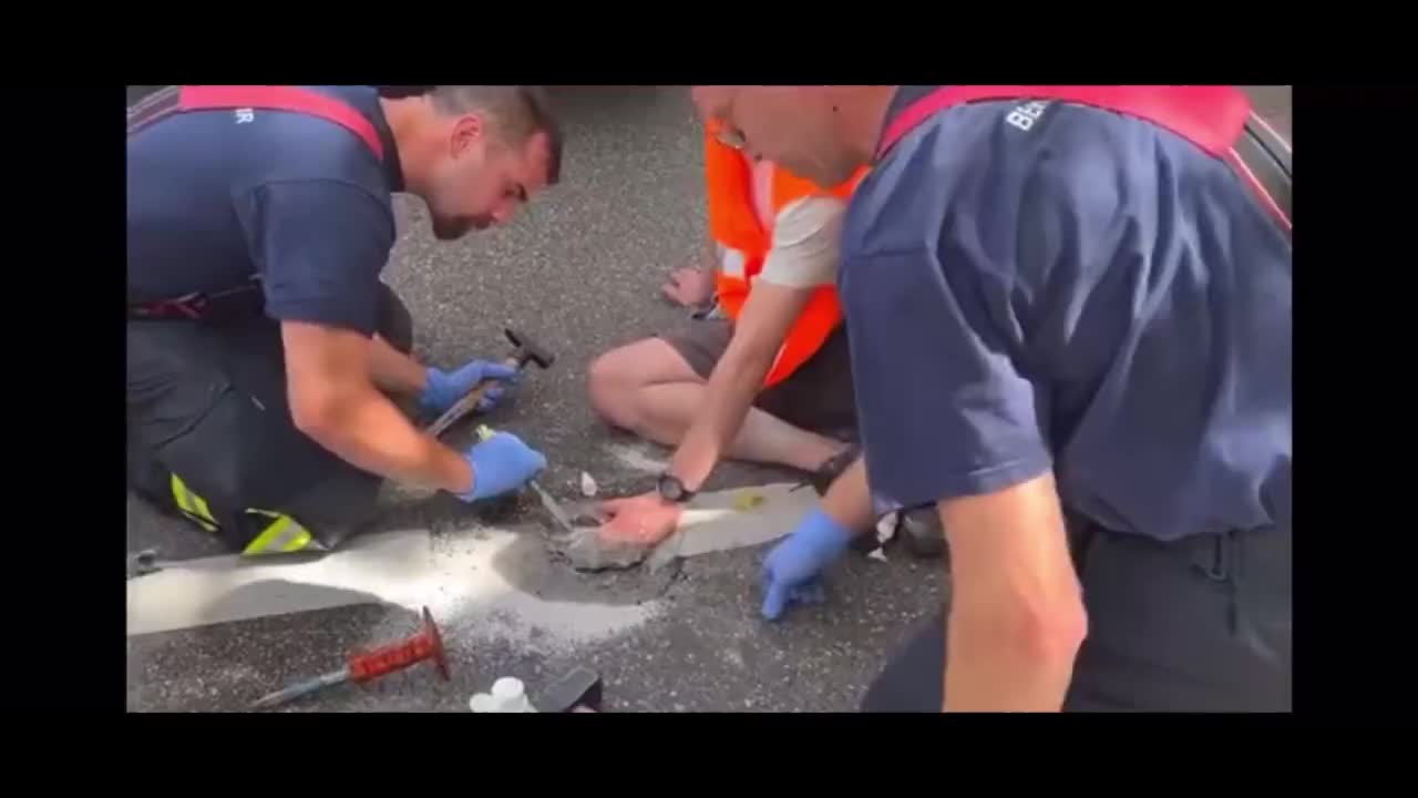 Eco Terrorist Screams in Pain as Fireman Frees His Glued Hand From Road